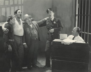 Lee rehearing actors in a faux jail cell
